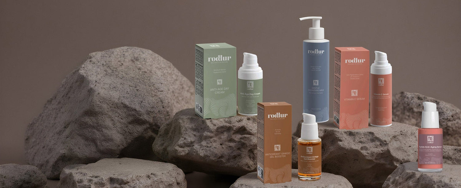 Cosmetic products on rocks with a neutral background